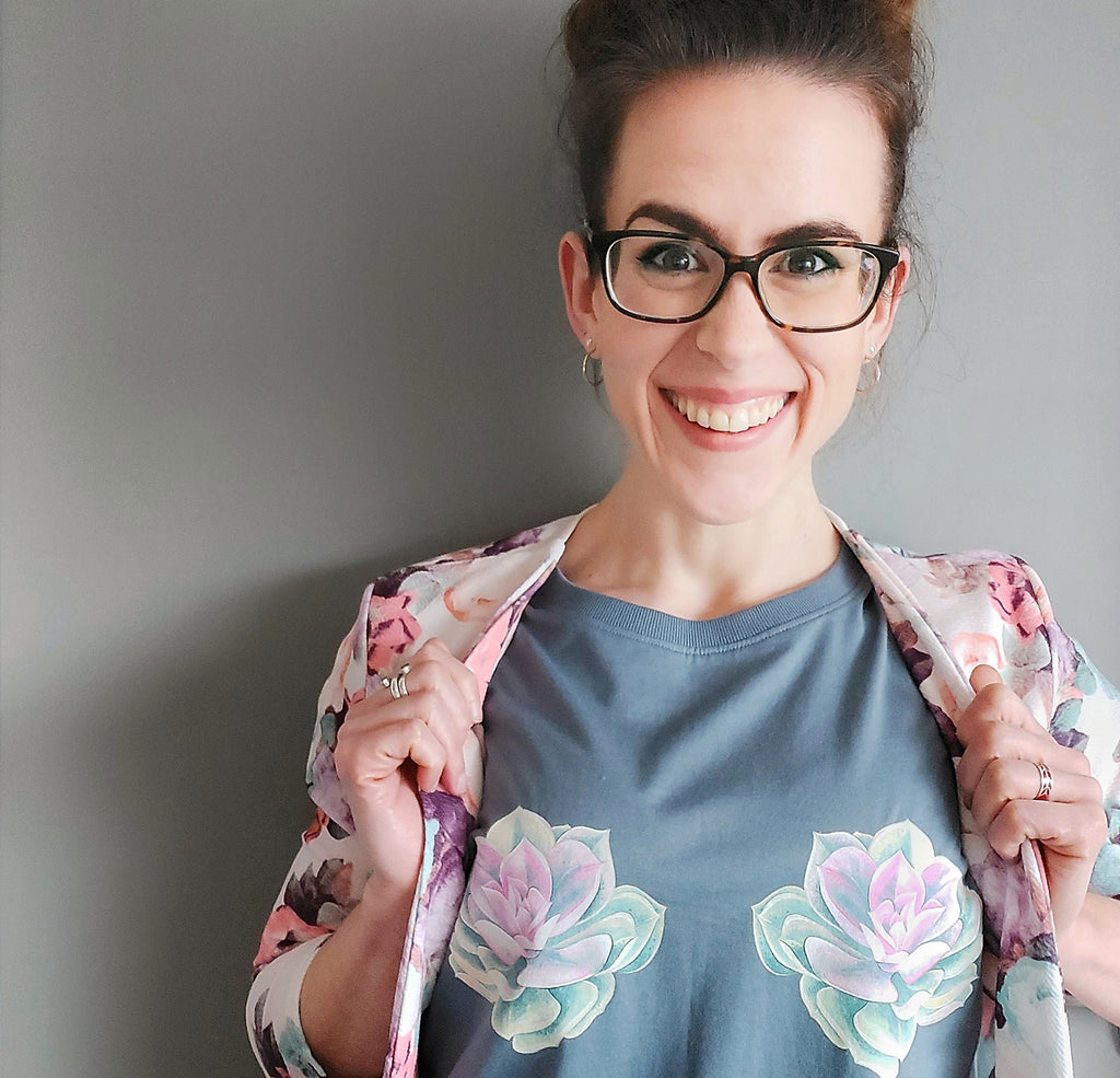 woman with glasses in succulent t-shirt and floral blazer